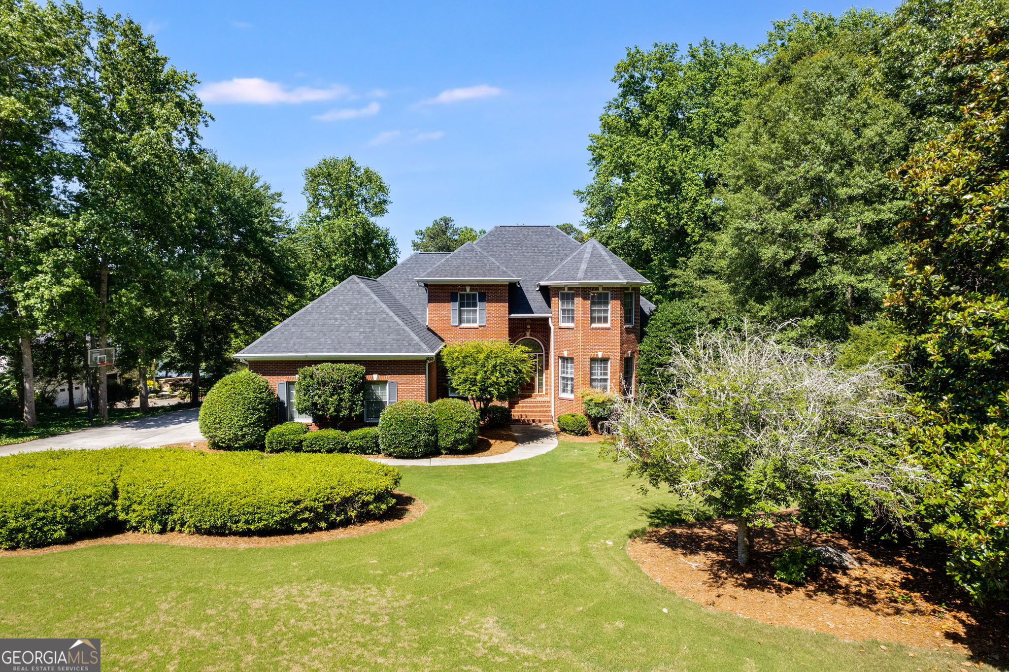 a front view of a house with a yard