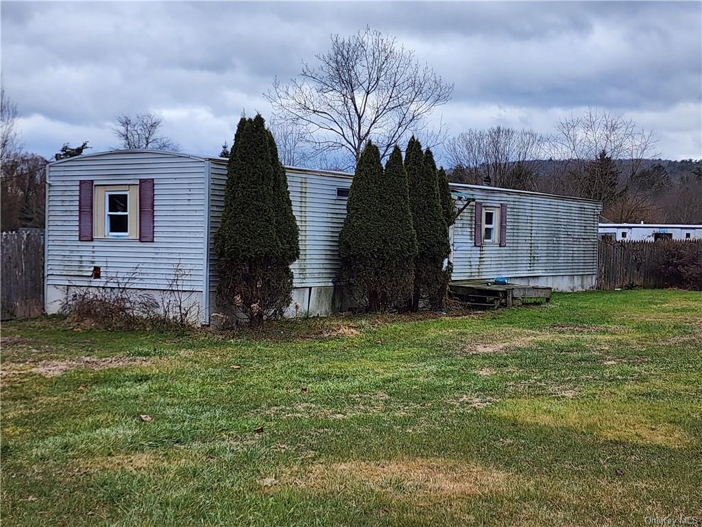 a view of a back yard of the house