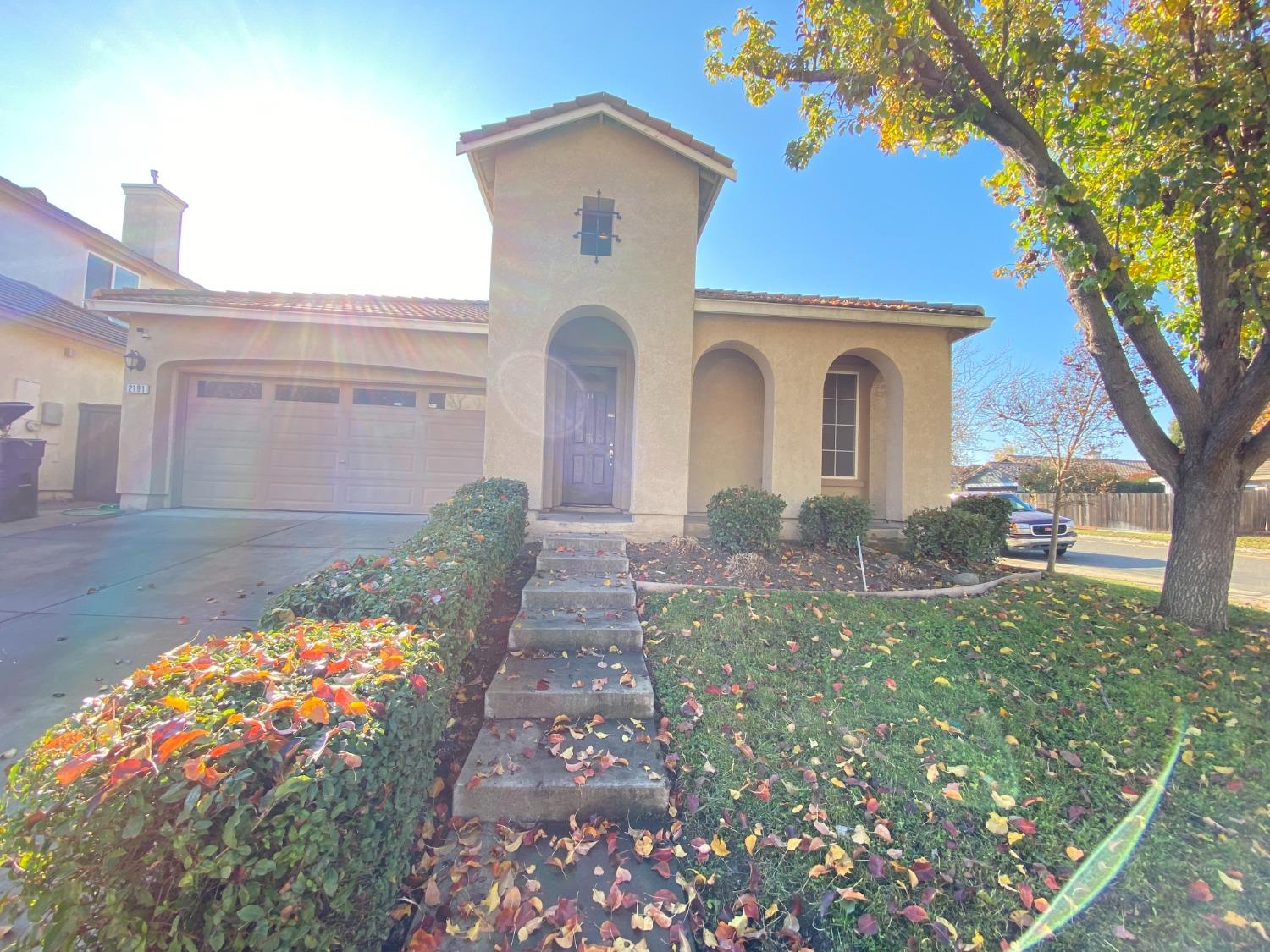 a front view of a house with garden