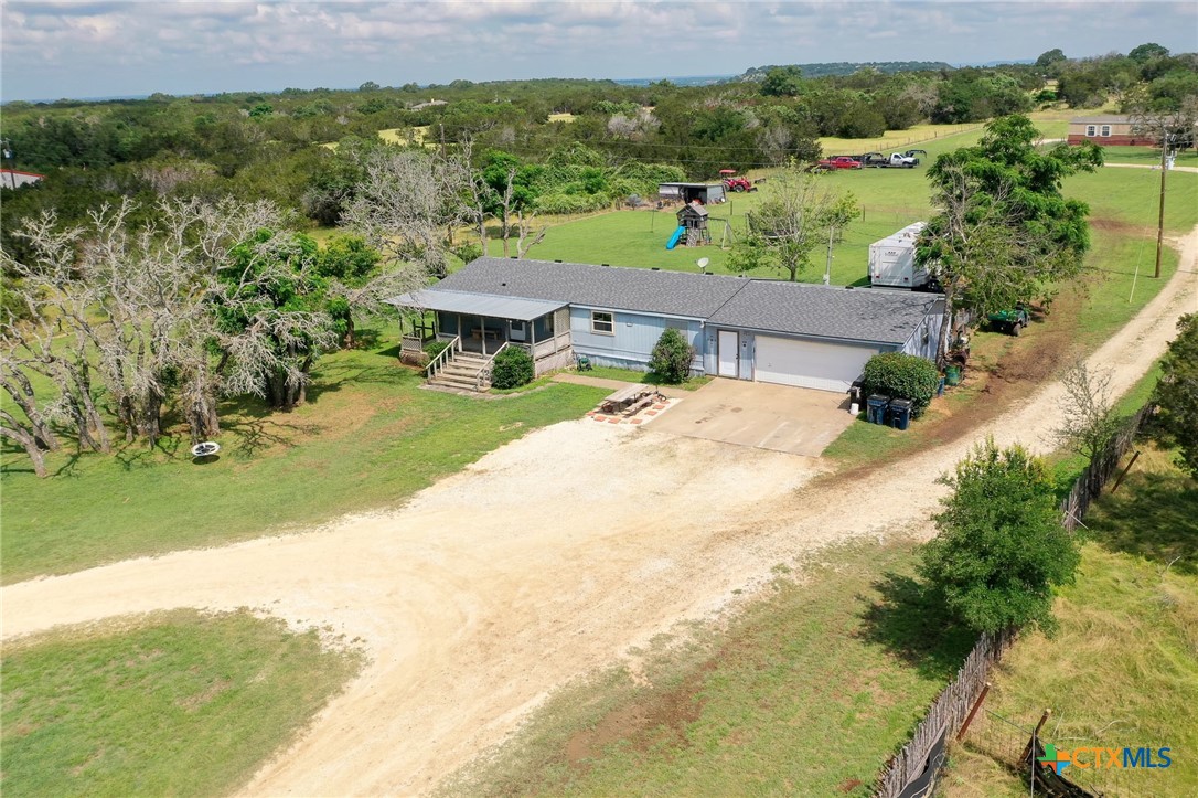 an aerial view of residential house with outdoor space