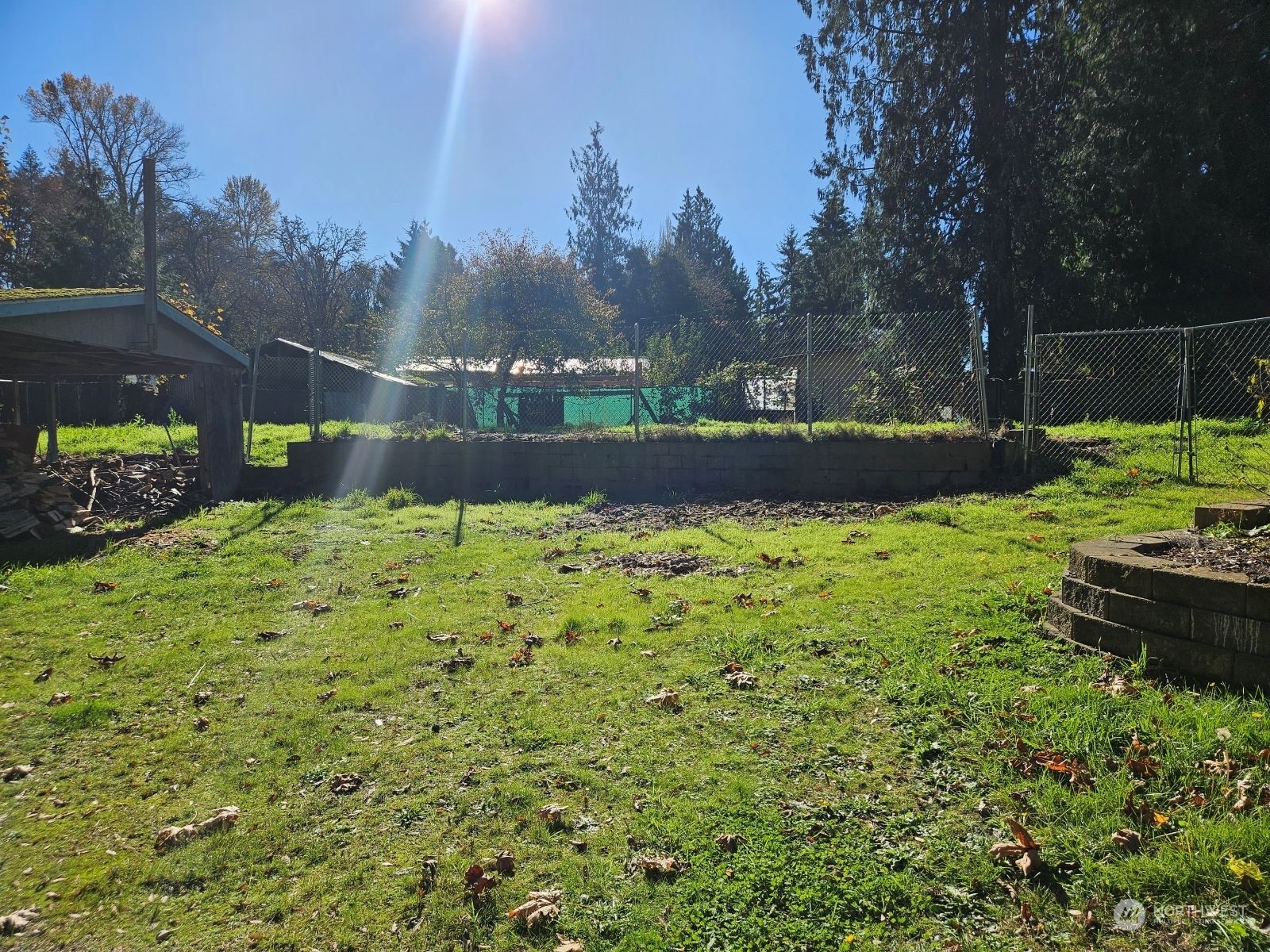 a view of a backyard with sitting area