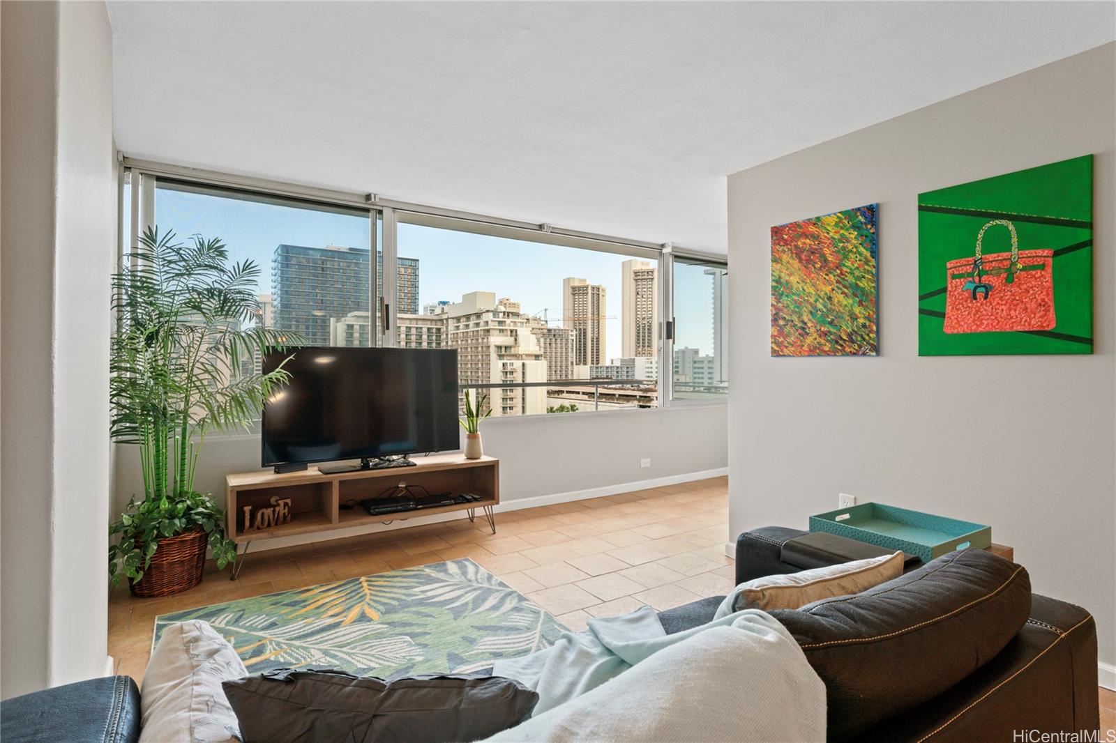 a living room with furniture and a flat screen tv