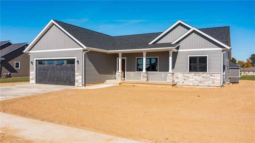 a front view of a house with yard and seating area