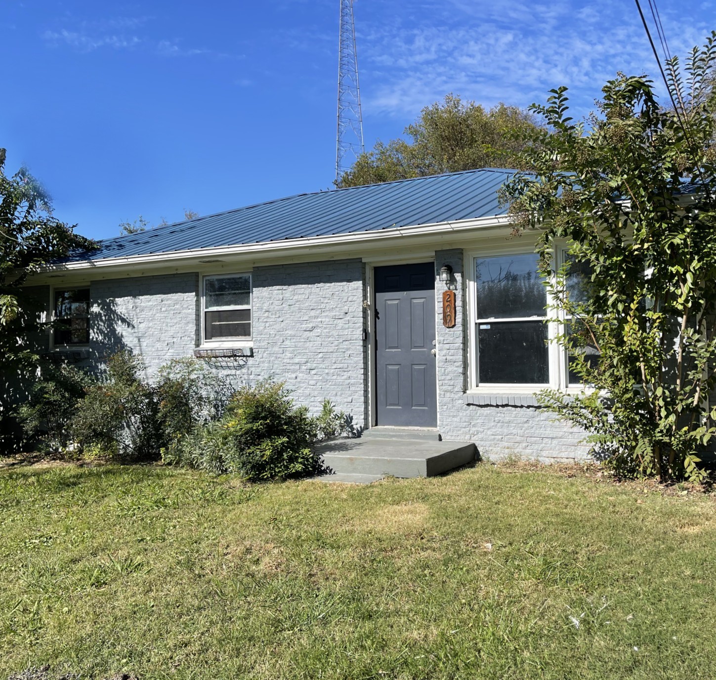 front view of a house with a yard