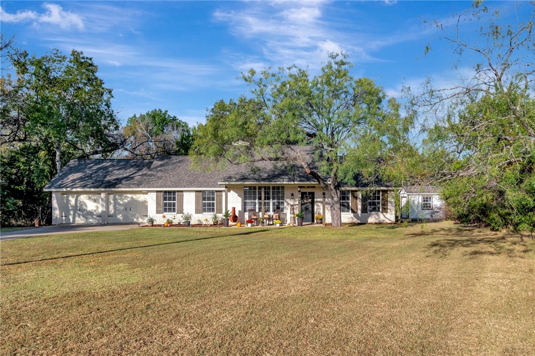 front view of a house with a yard