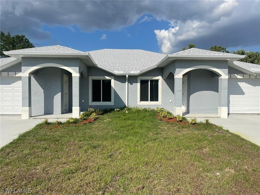 a front view of a house with a yard