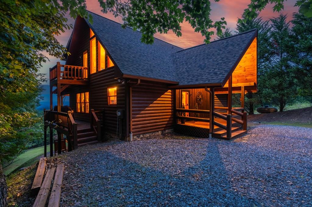 a backyard of a house with barbeque oven and trees