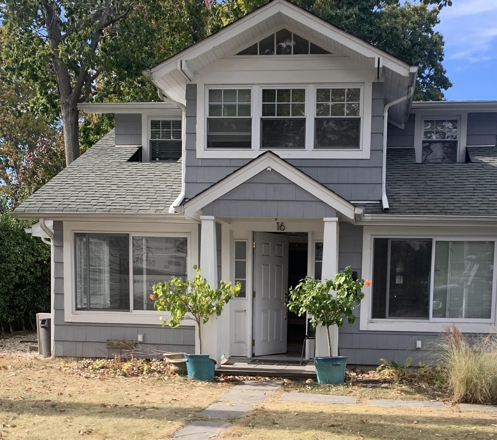 a front view of a house with yard