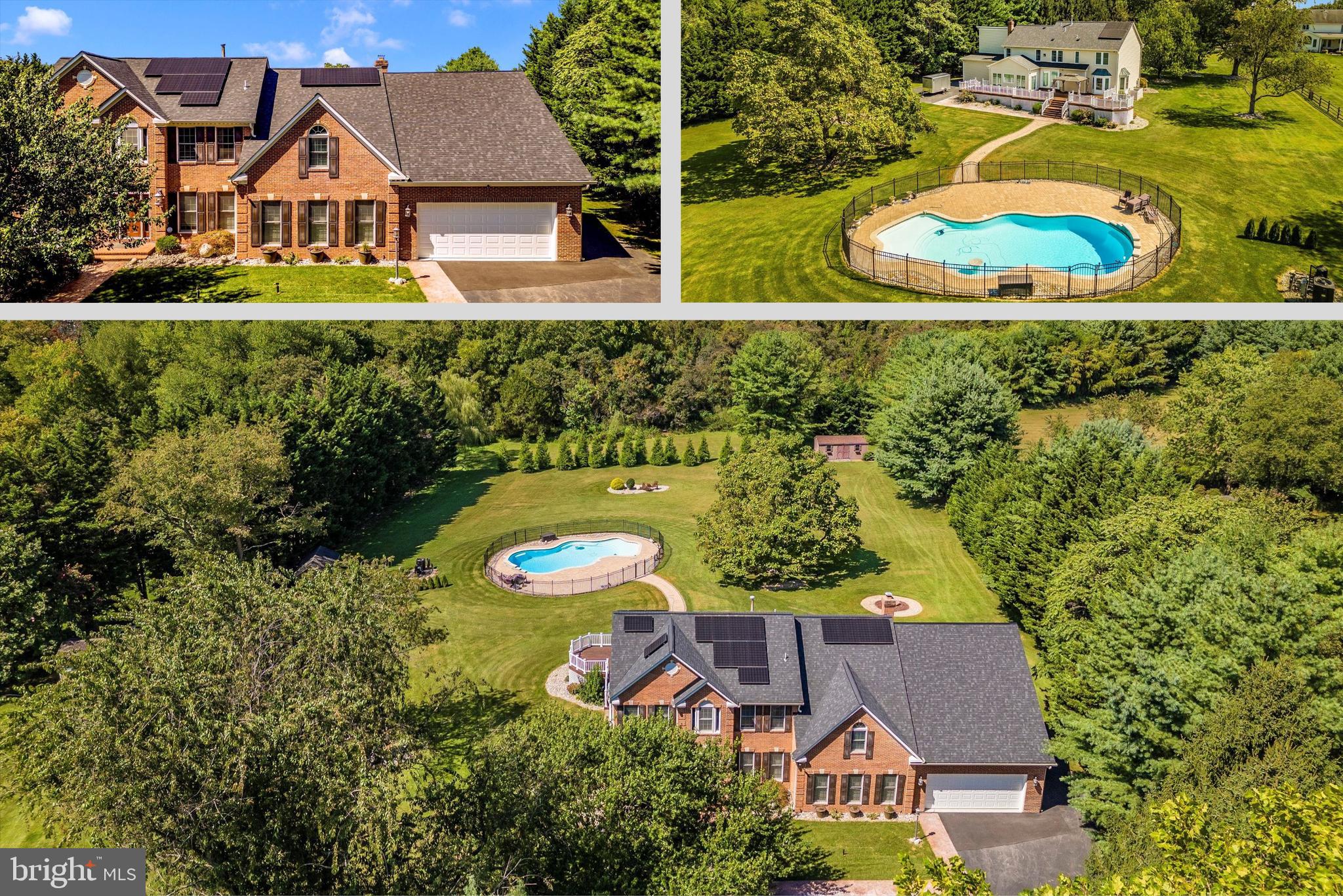 an aerial view of a house with a garden and lake view