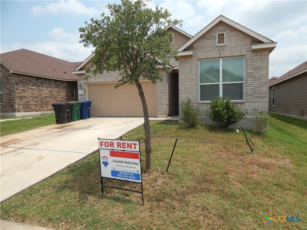 a house with yard in front of it