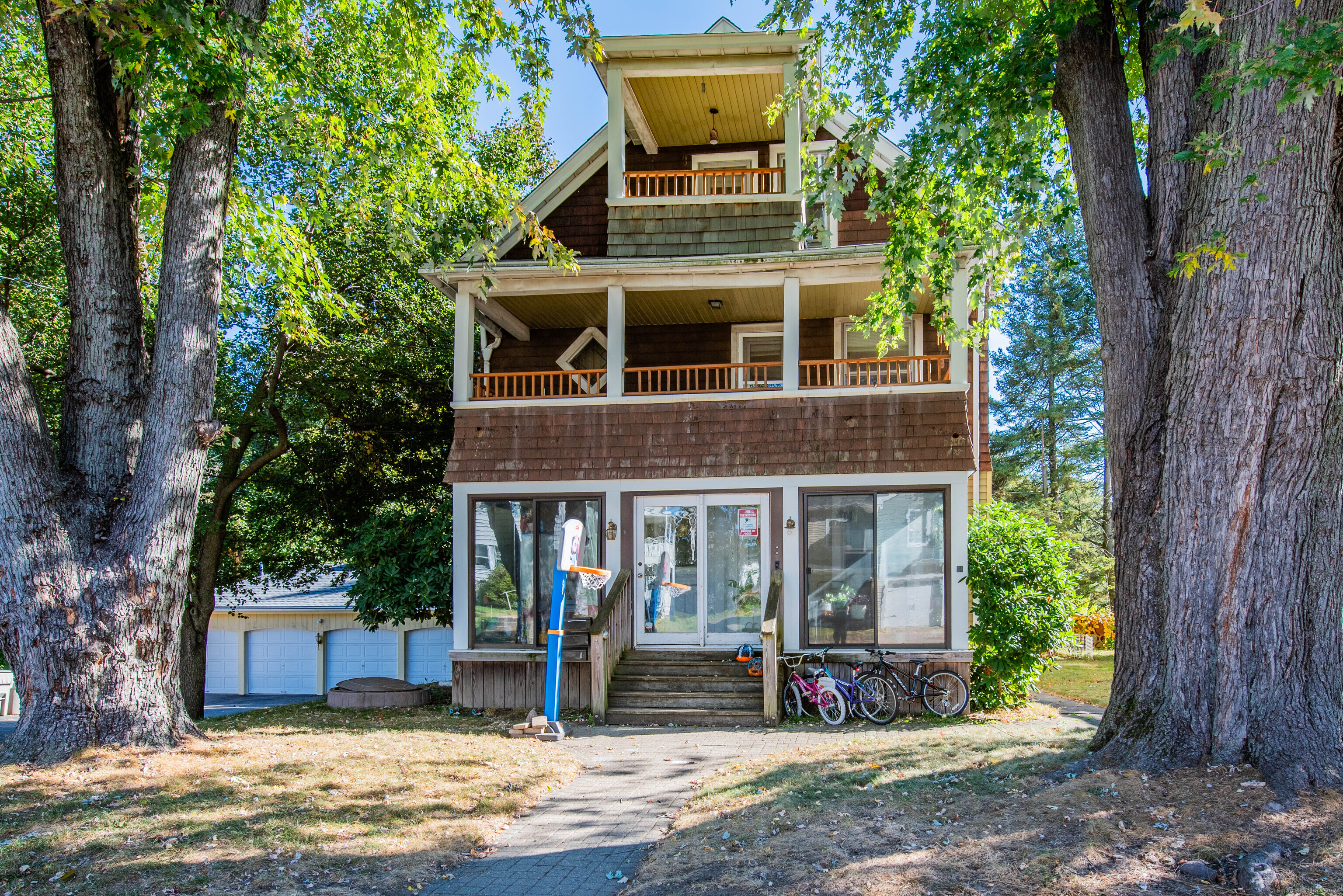 a front view of a house with garden