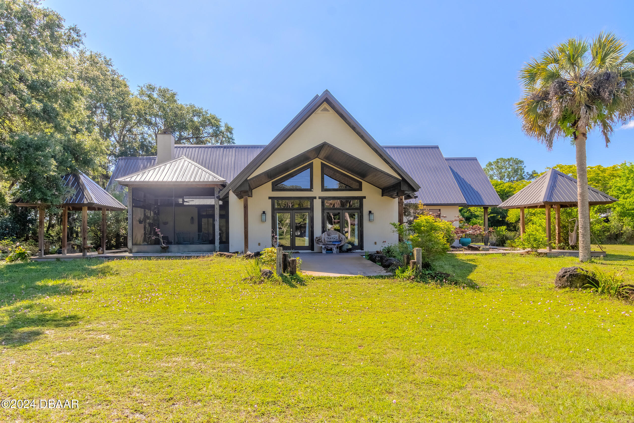 a view of a house with swimming pool and porch