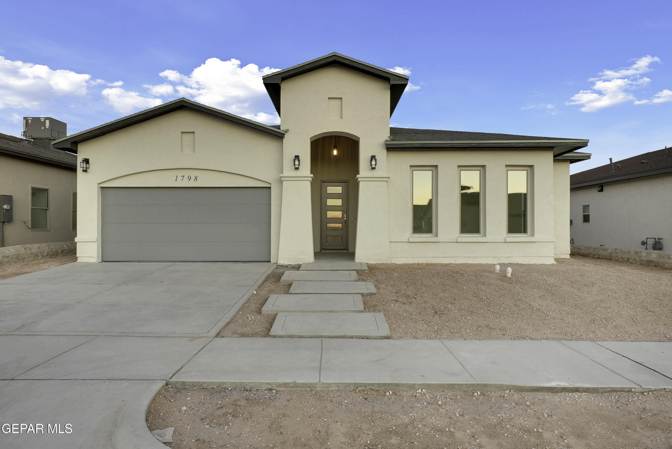 a front view of a house with garage