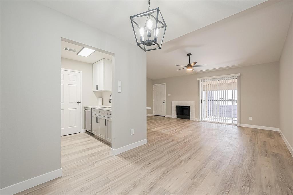 a view of a kitchen stove and wooden floor