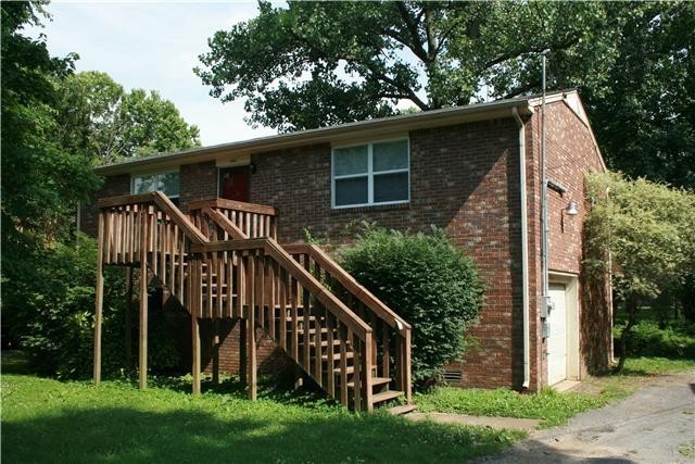 a view of front of house with a yard