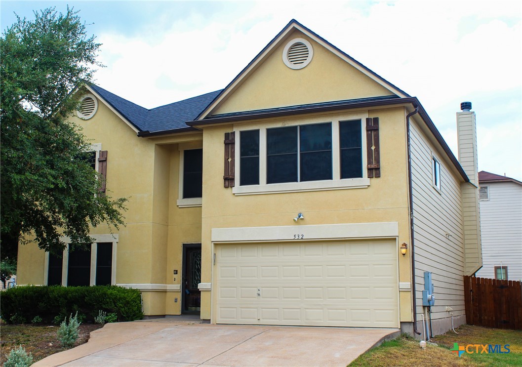 a view of a house with a garage