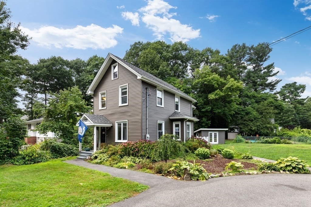 a front view of a house with a yard