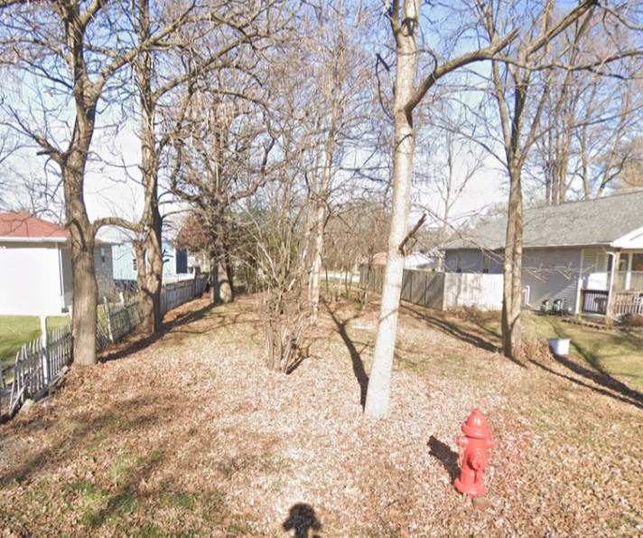 a view of a yard covered in snow