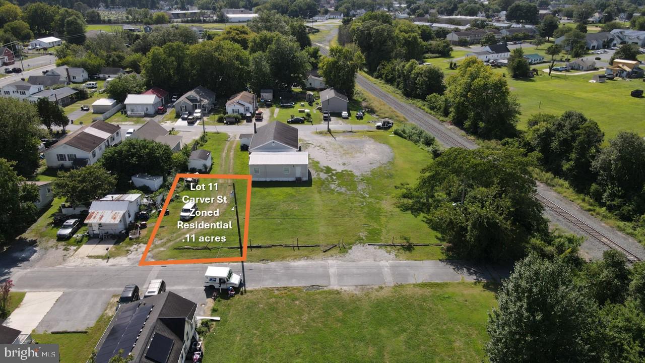 an aerial view of residential house with outdoor space and swimming pool