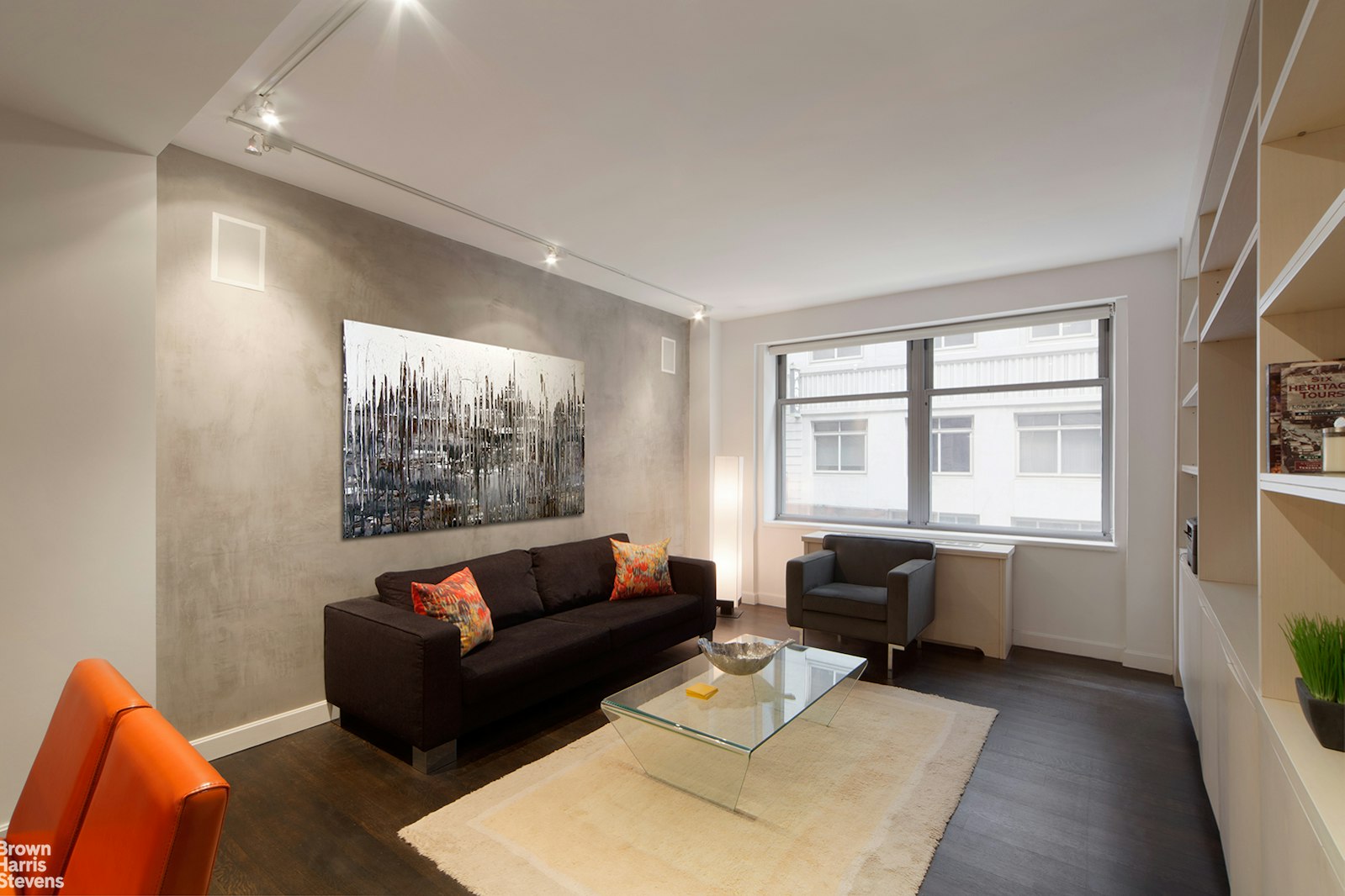 a living room with furniture and a window