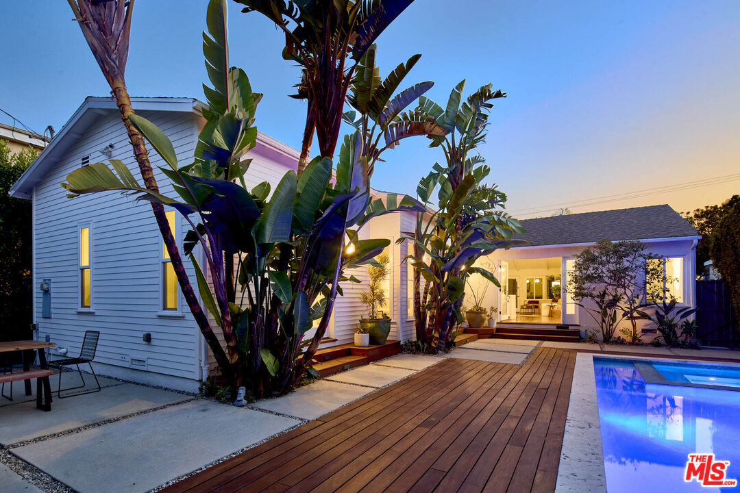 a view of a house with a tree