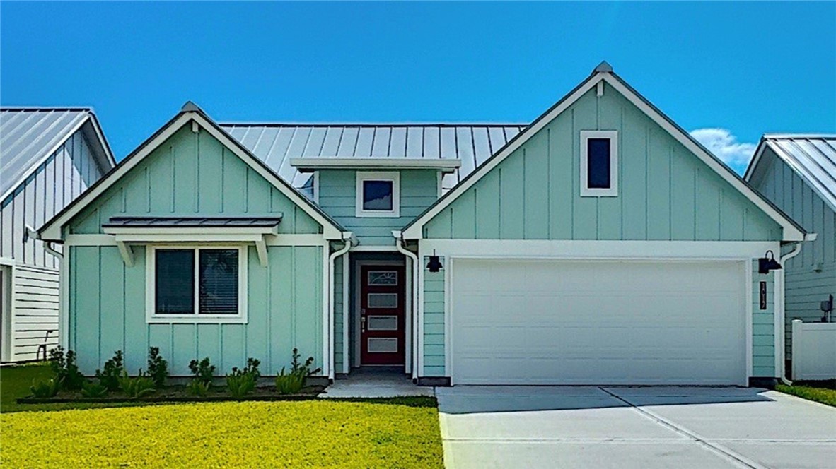 a front view of a house with garage