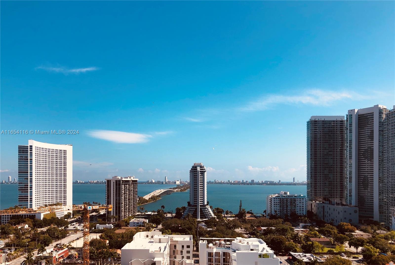 a view of a ocean with tall buildings