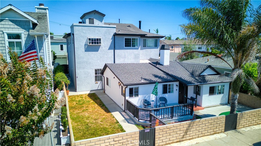 a aerial view of a house with swimming pool and sitting area