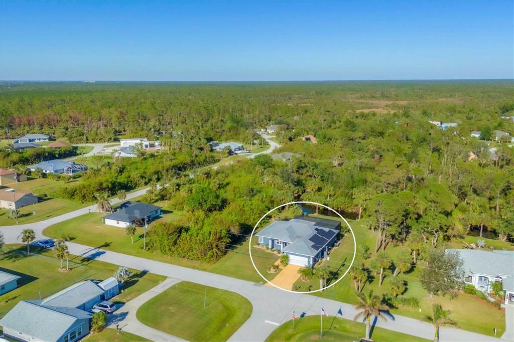 an aerial view of residential house with outdoor space