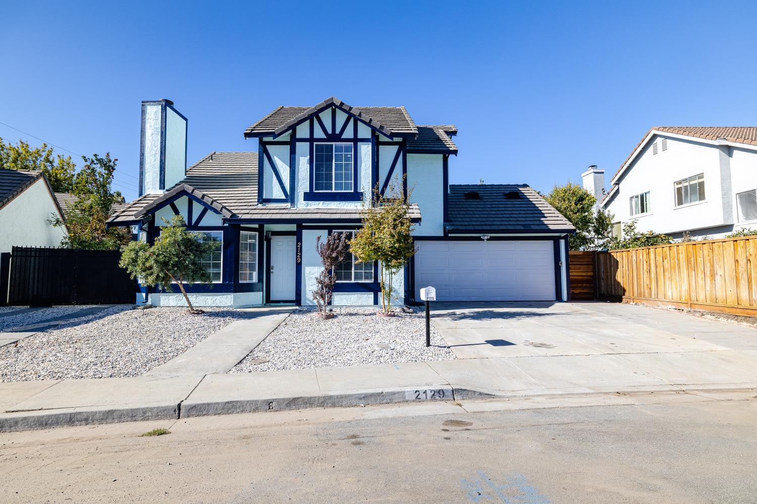 front view of a house with a street