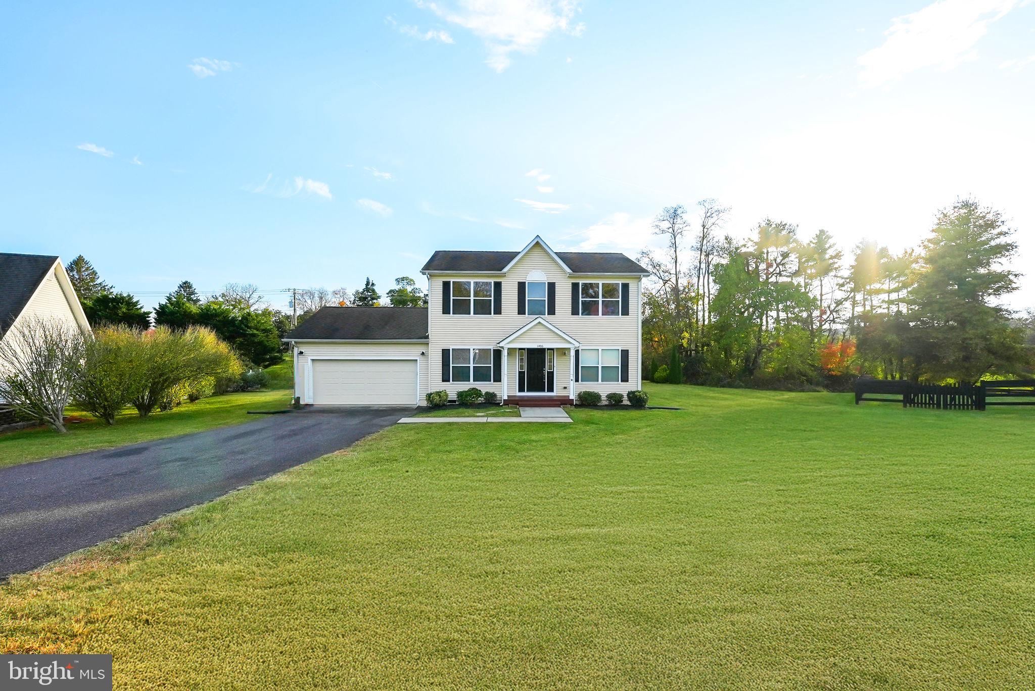 a view of a house with a big yard