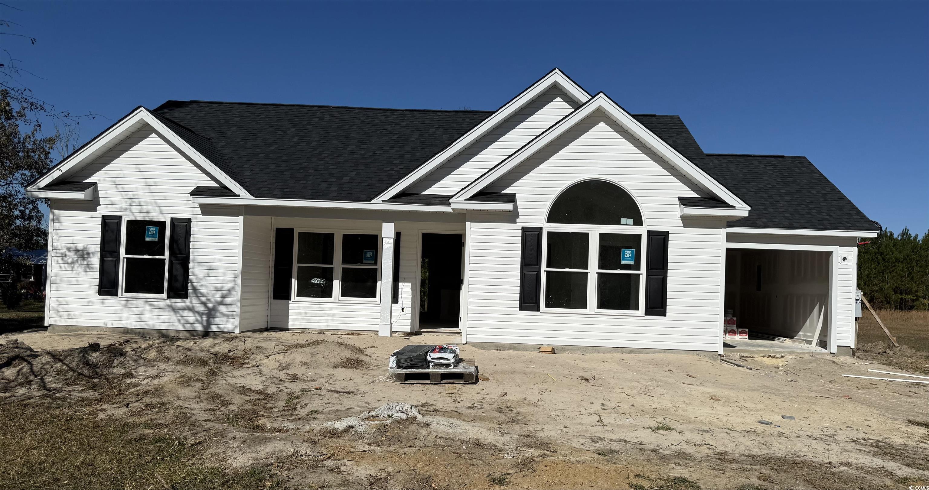 View of front of property with a garage