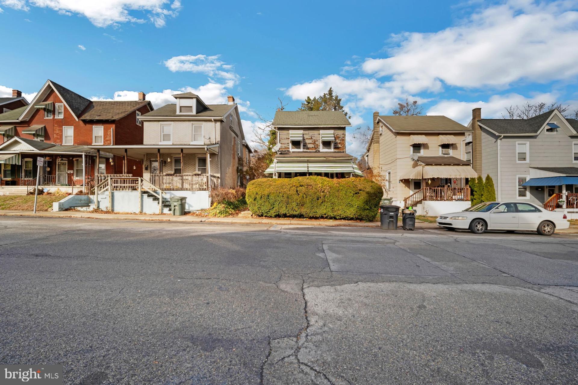 a view of multiple houses with a street