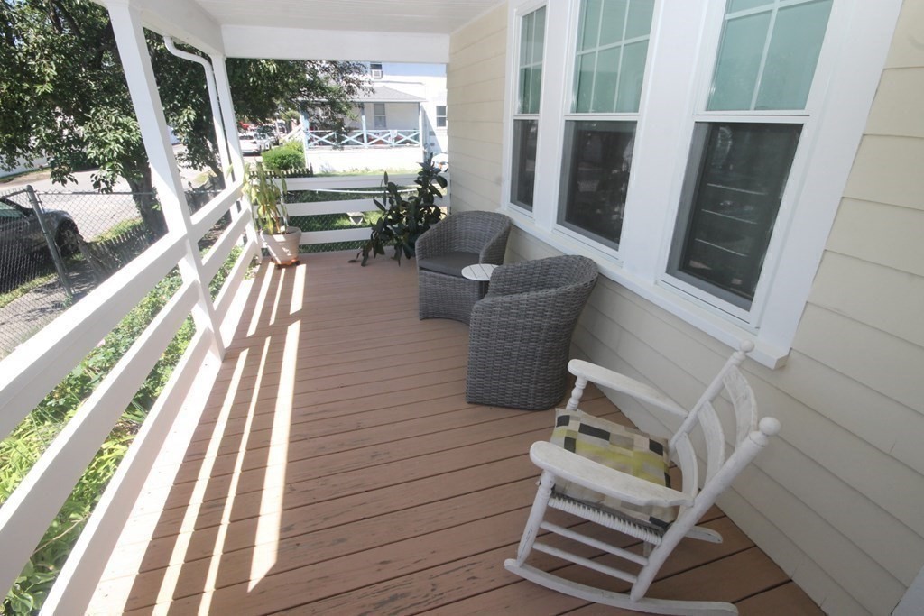 a view of balcony with furniture