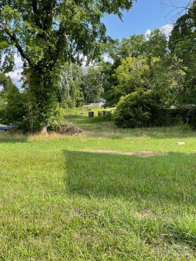 a view of a field with an trees