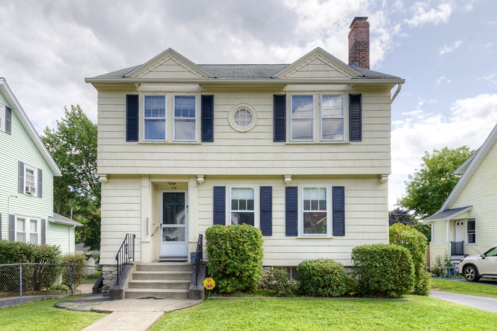 a front view of a house with a yard