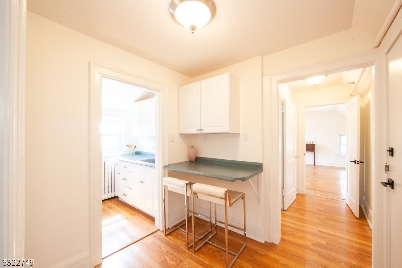 a kitchen with granite countertop a sink and a stove