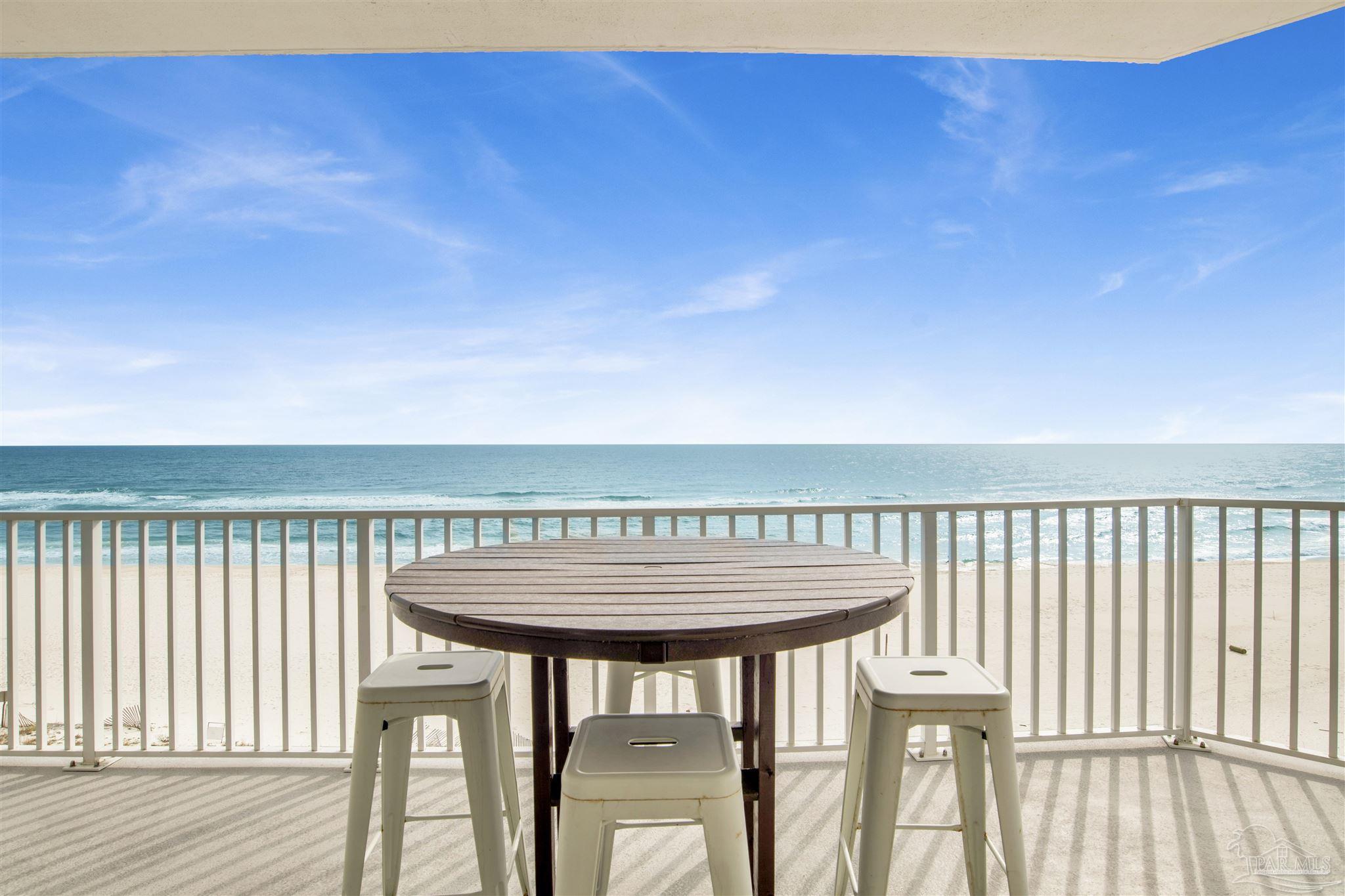 a view of a balcony with chairs