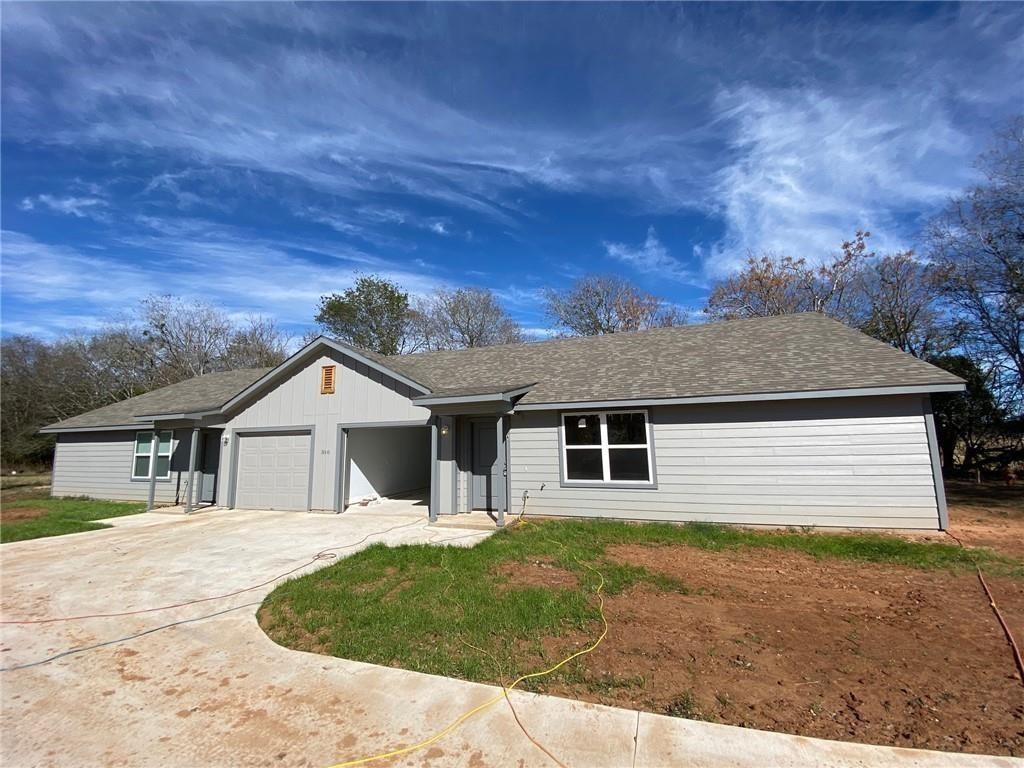 a house with trees in the background