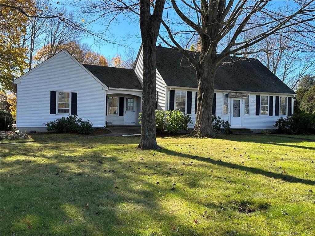 a view of a house with a yard