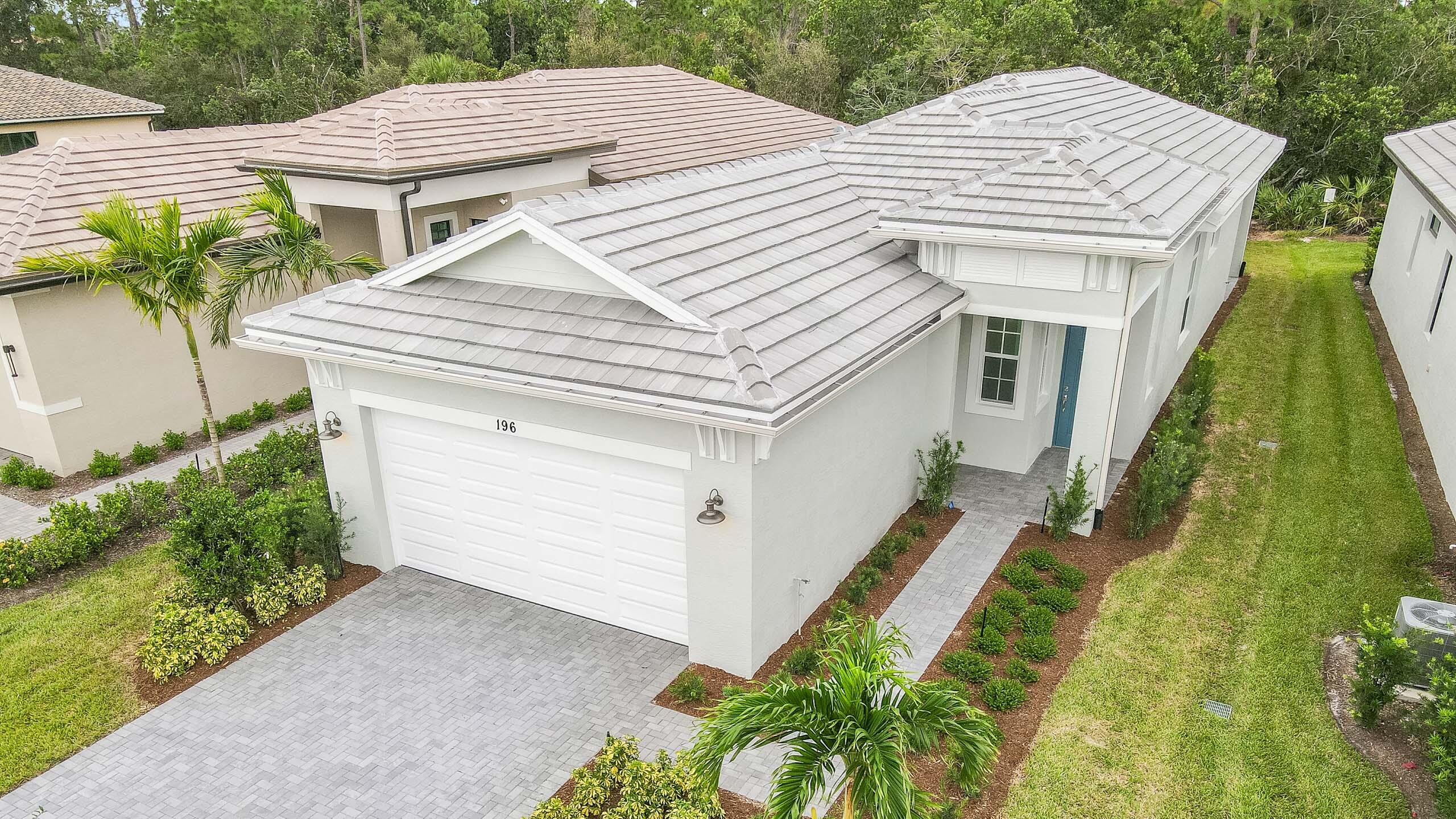 a aerial view of a house with a yard