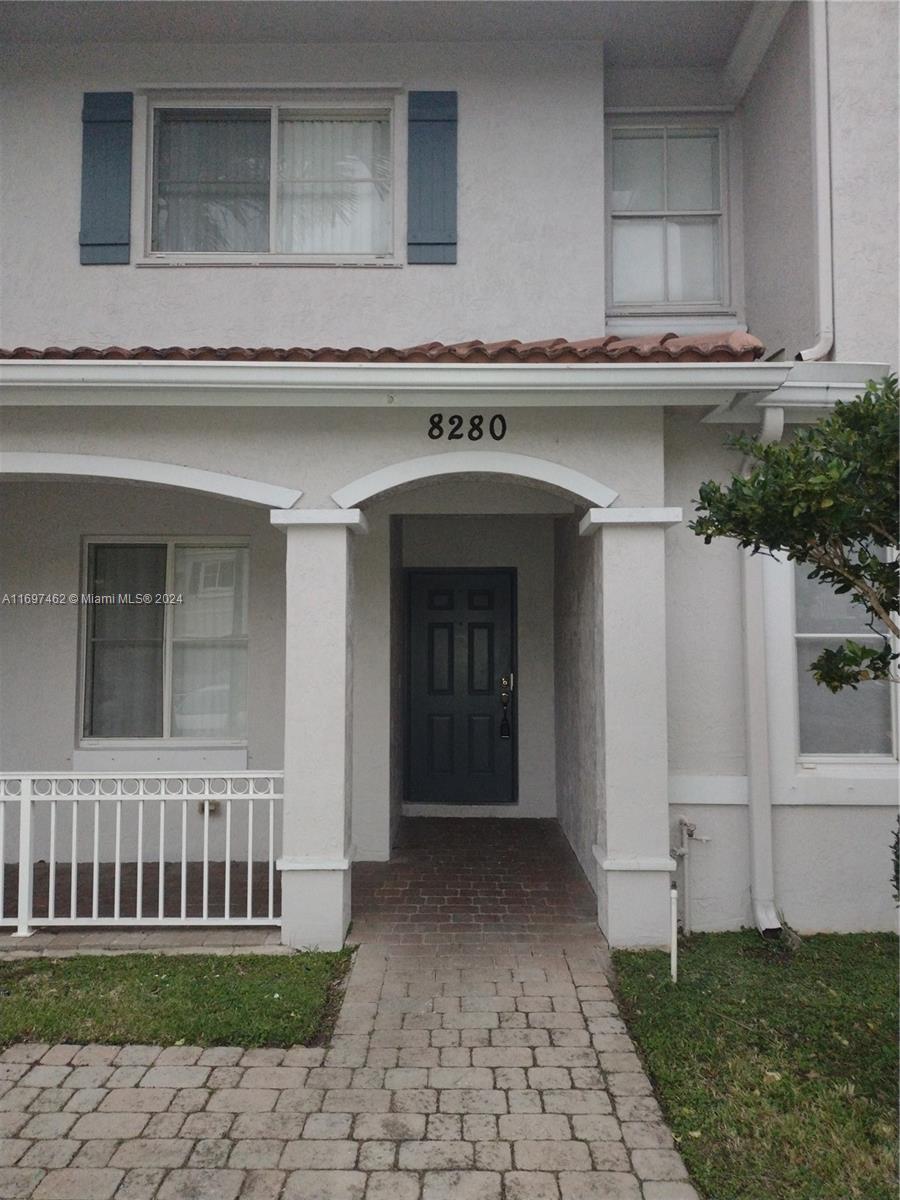 front view of a house with a yard