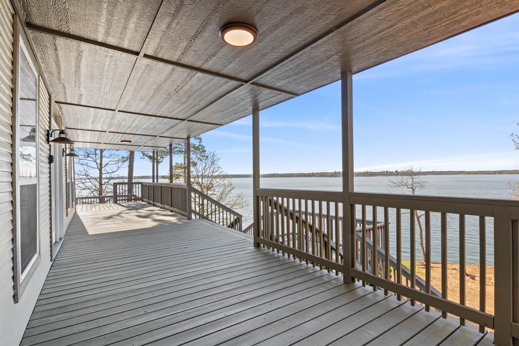 a view of a balcony with wooden floor