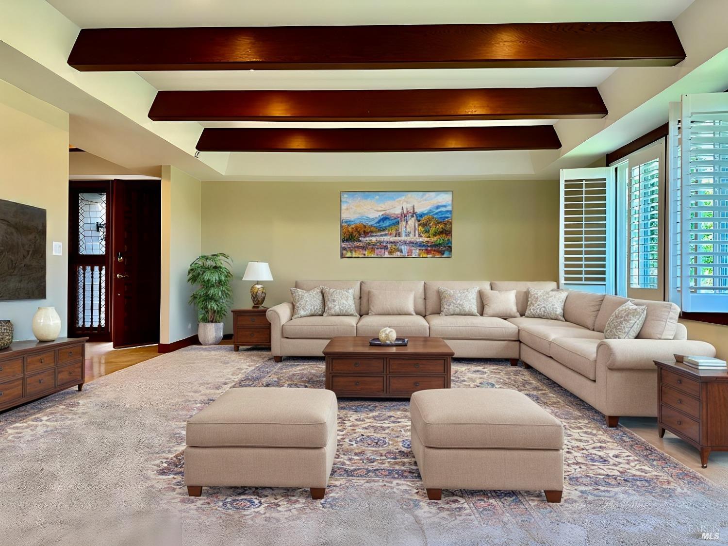 a living room with furniture and windows