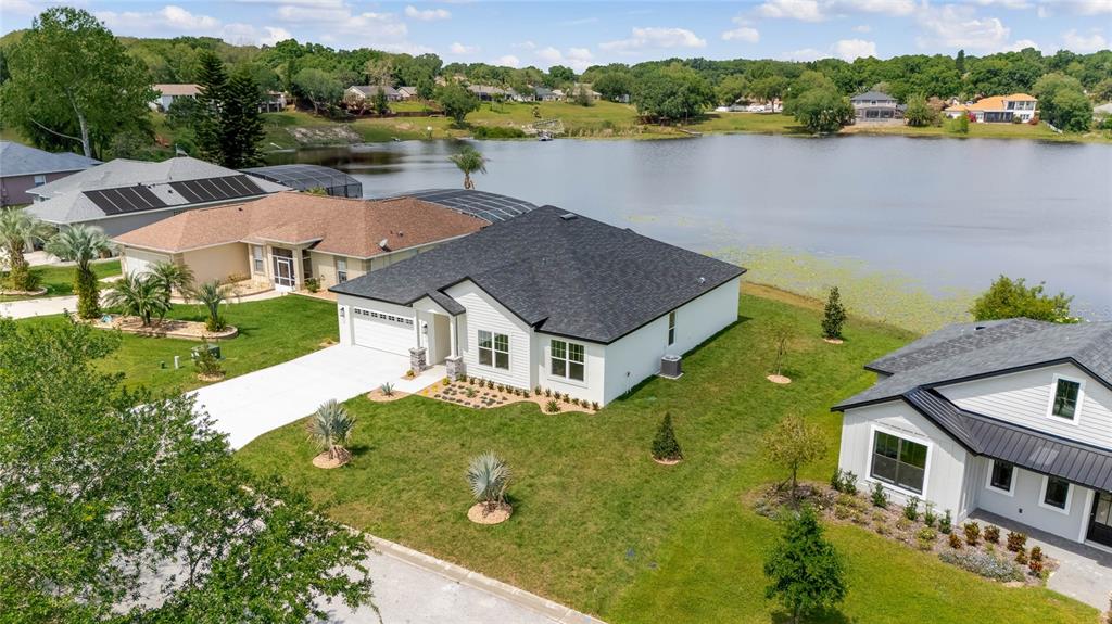 an aerial view of houses with yard