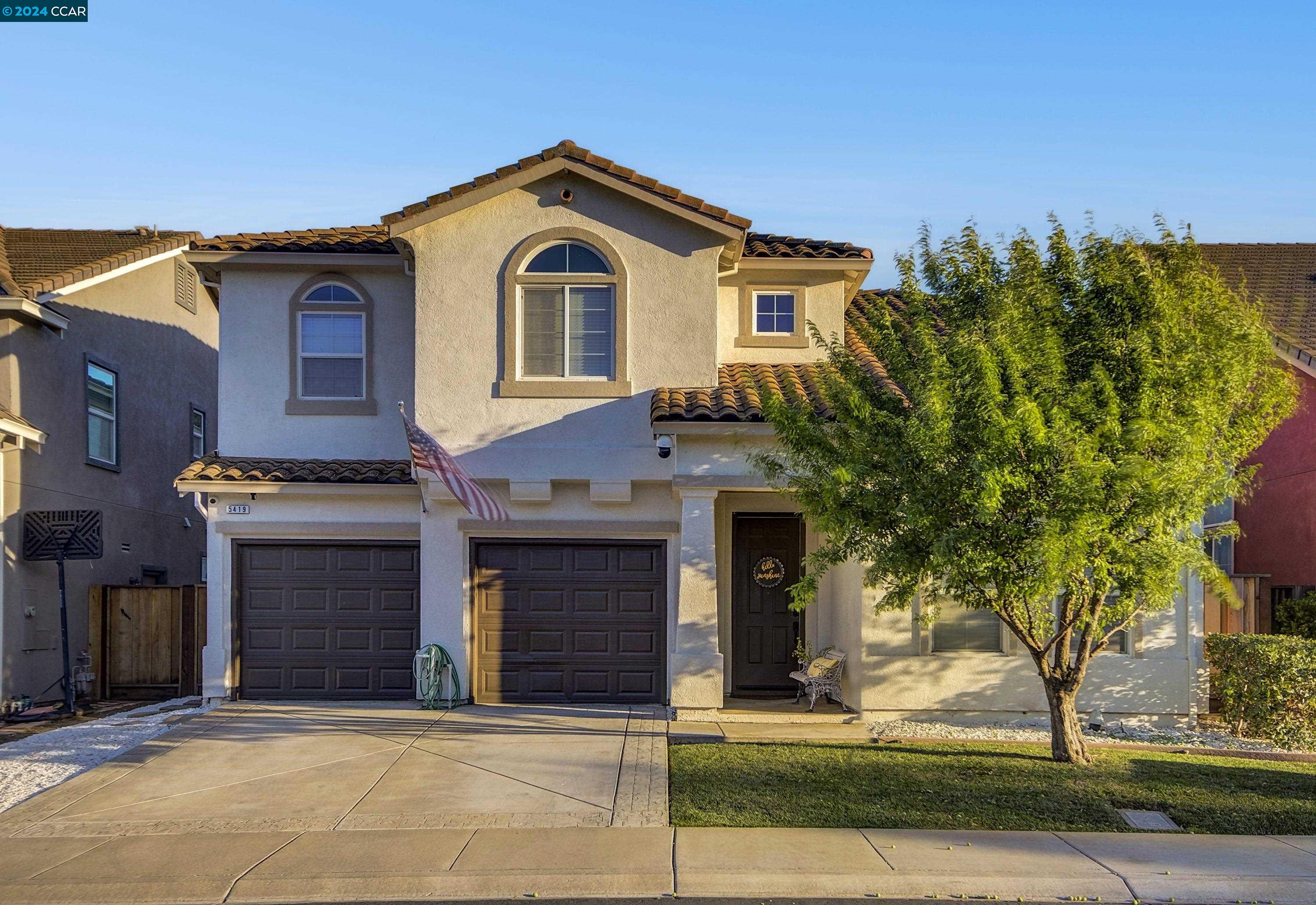 a front view of a house with a garage