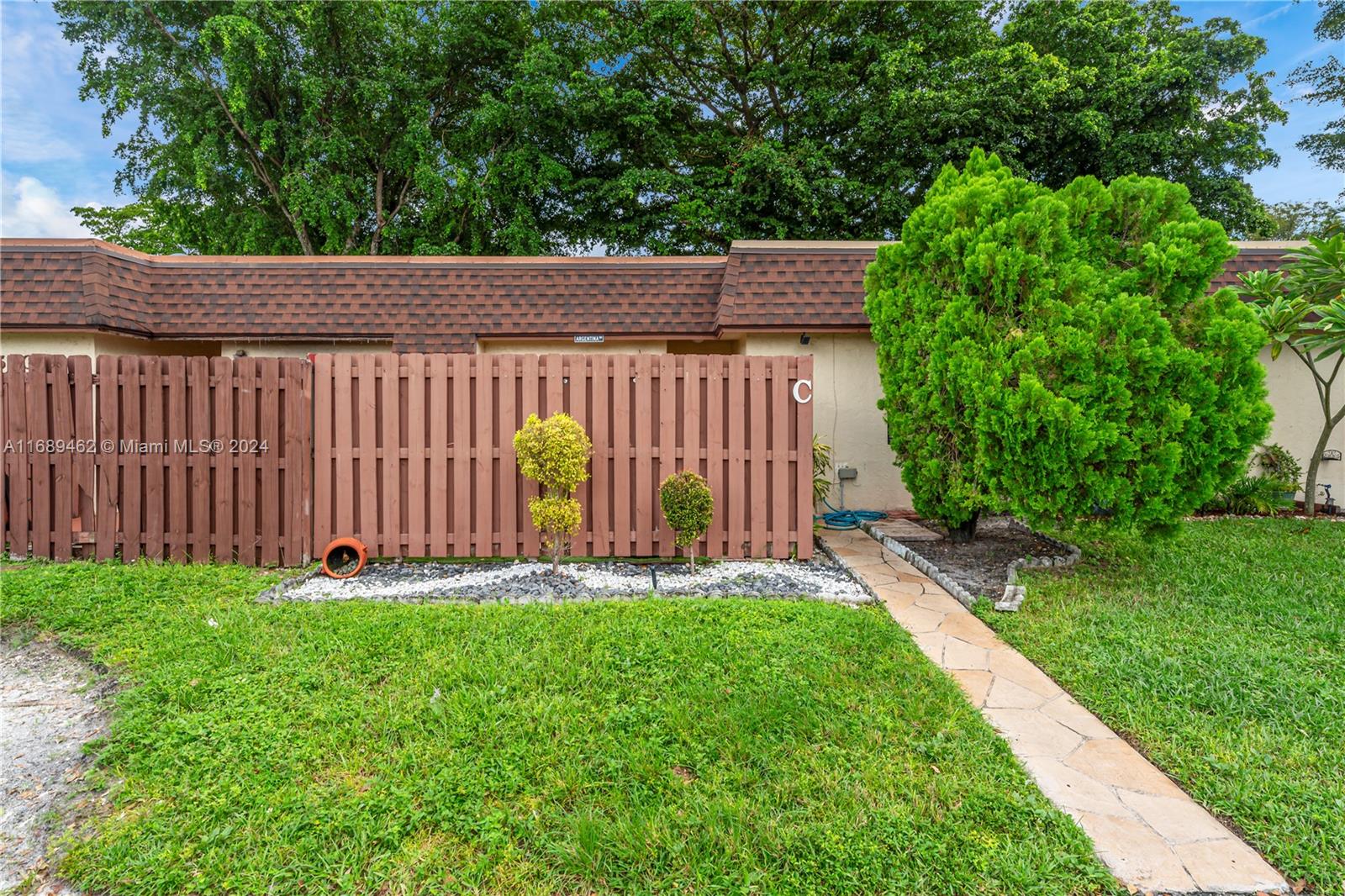 a backyard of a house with lots of green space