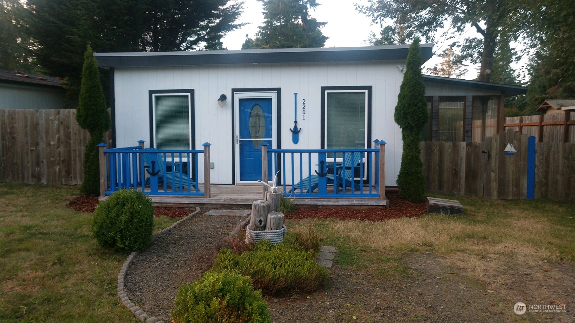 a view of porch with a table and chairs