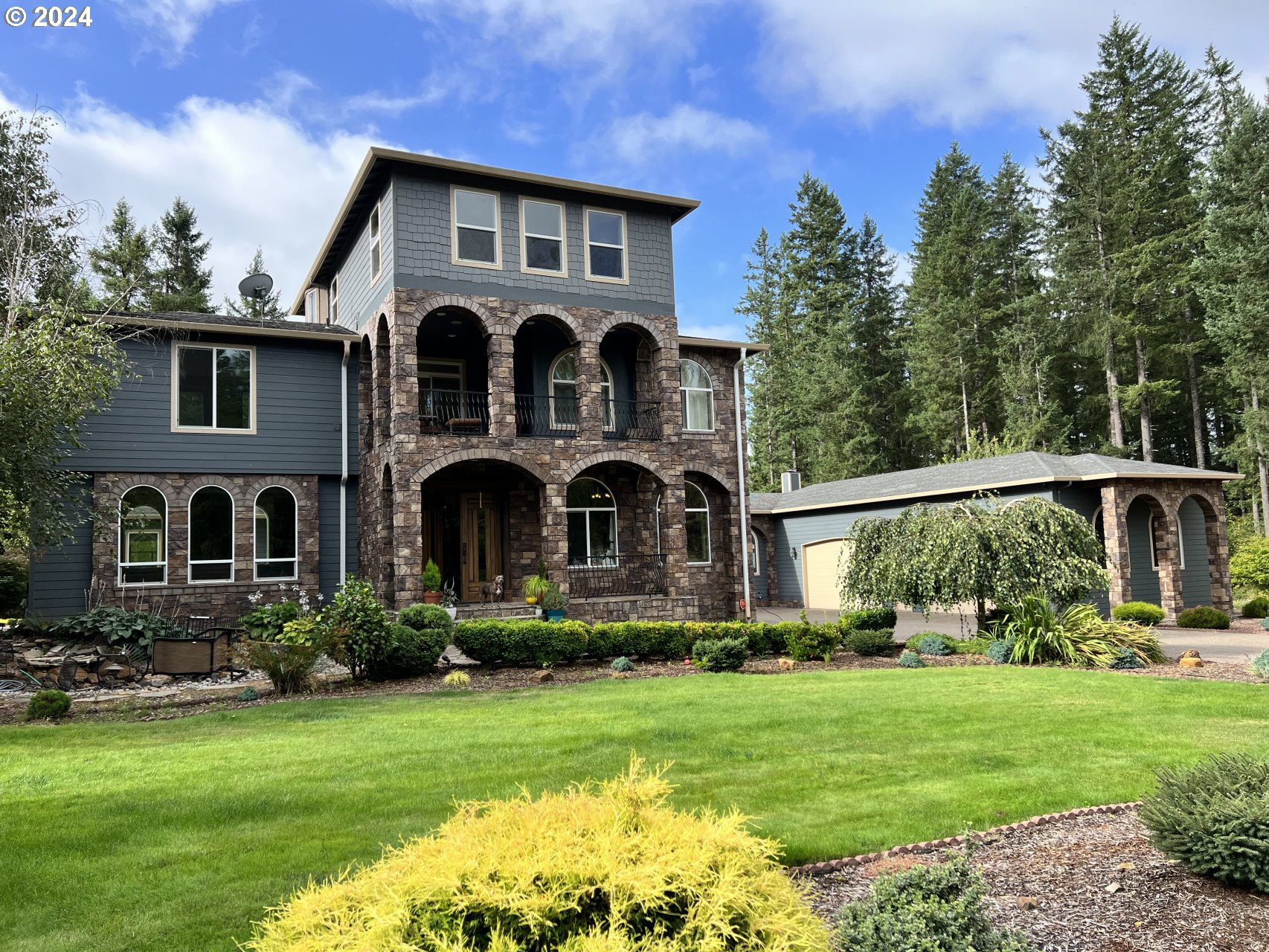 a front view of house with yard and green space