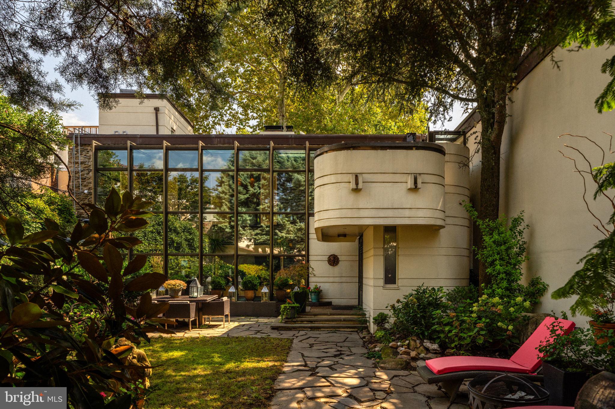 a view of a patio with table and chairs and potted plants